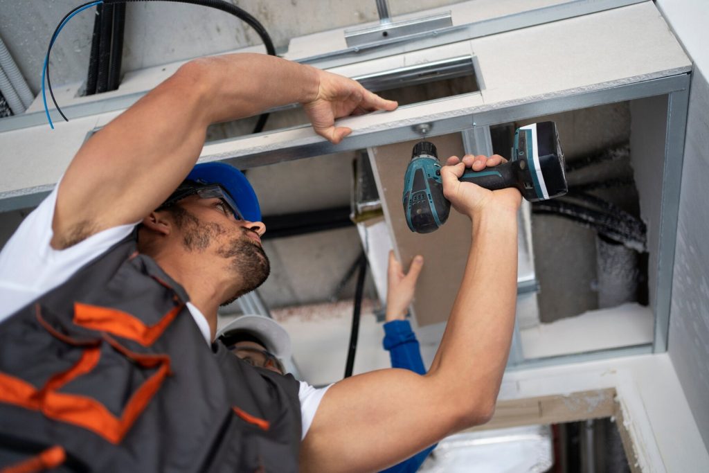 low angle people working with drill 23 2149366670